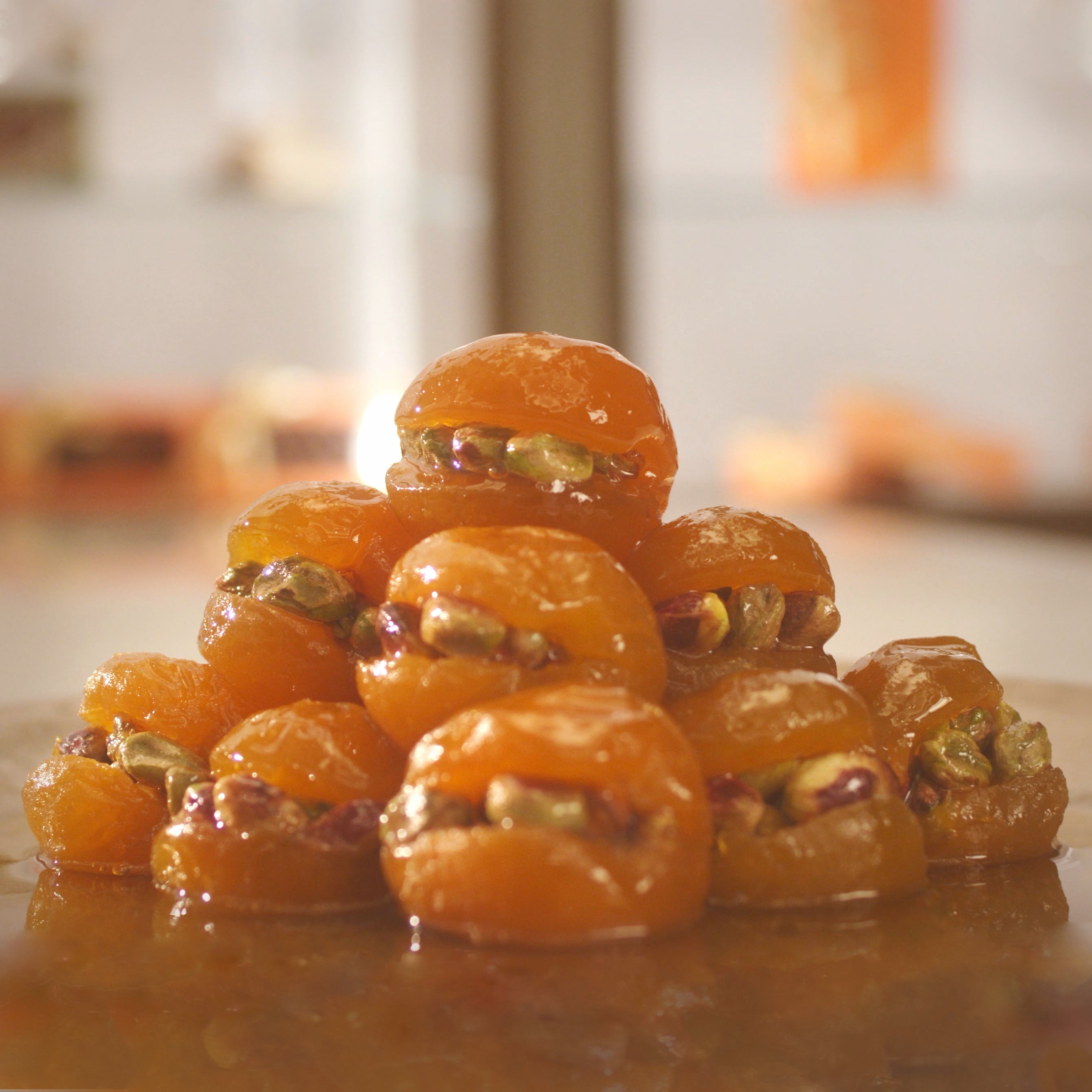 Candied apricots with pistachios arranged in a pyramid shape